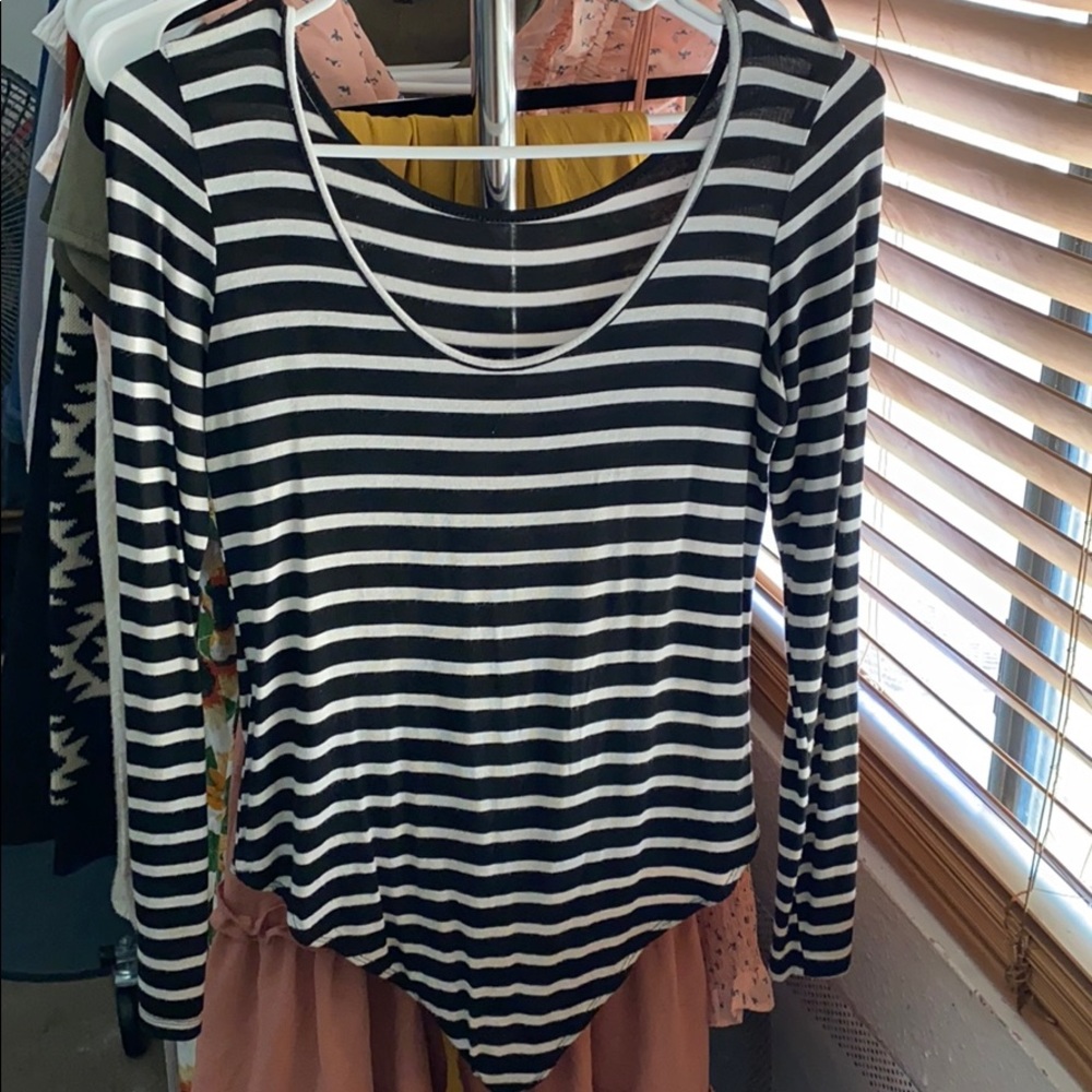 I am selling a black and white stripped body suit